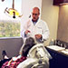 Dr. Koslowski talking with patient in dentist chair